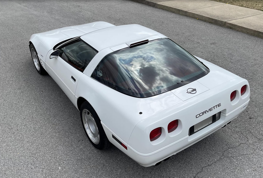white 1991 chevy corvette on chrome wheels